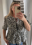 Leopard Tie Front Peplum Top